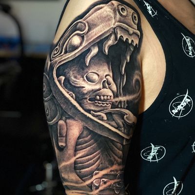Read more about the article Realism skull and snake Tattoo by Goethe Silva — Los Angeles, CA